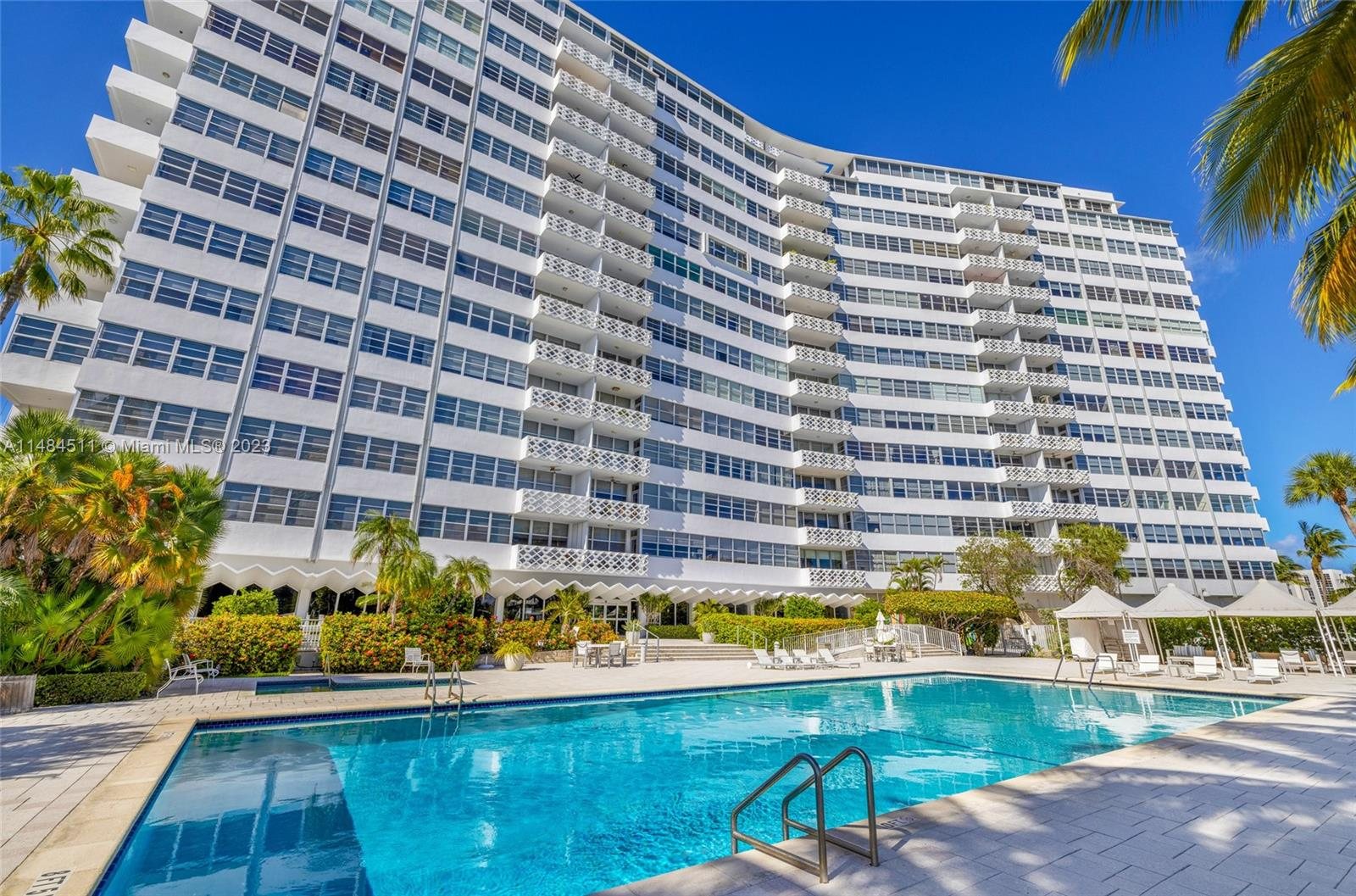 Belle Plaza's curved 15-story facade over the bayfront pool