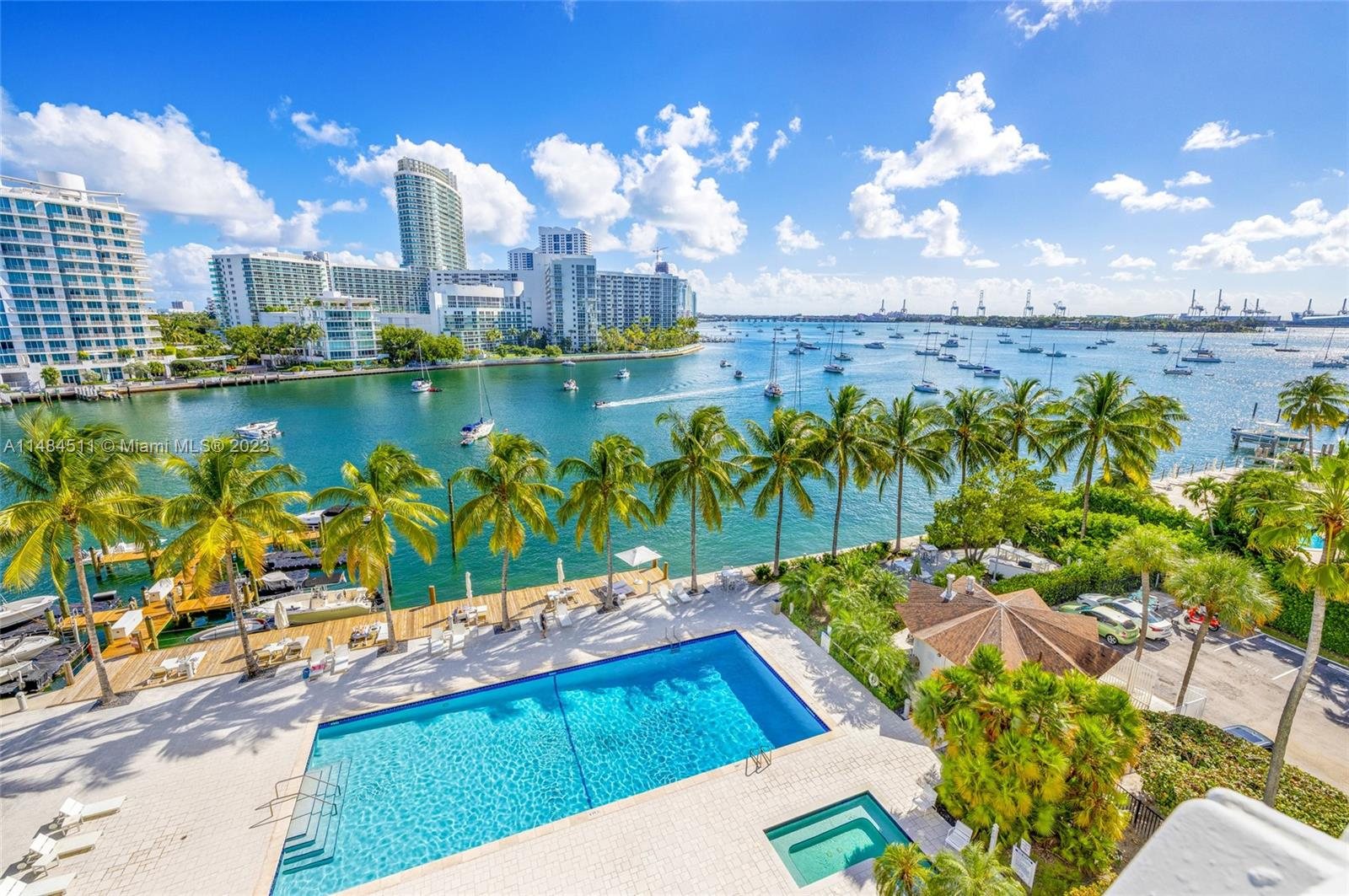 Pool deck, marina and Biscayne Bay with the Miami skyline beyond
