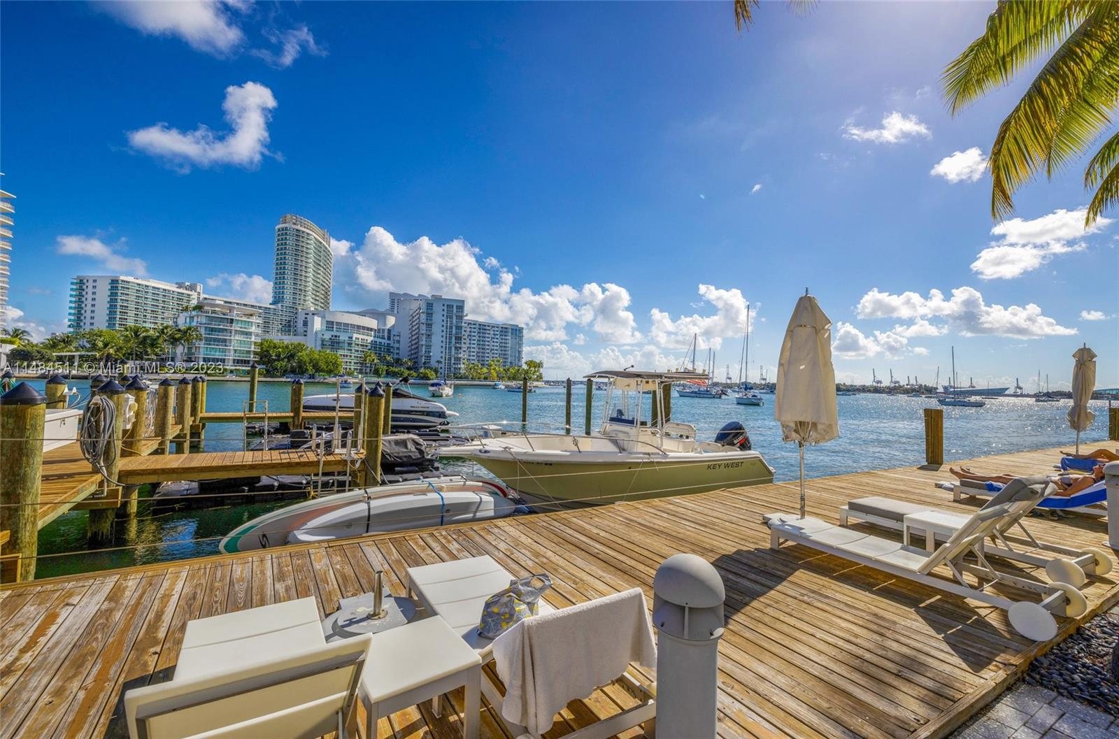 Sun deck and loungers on the bay, steps from the marina slips