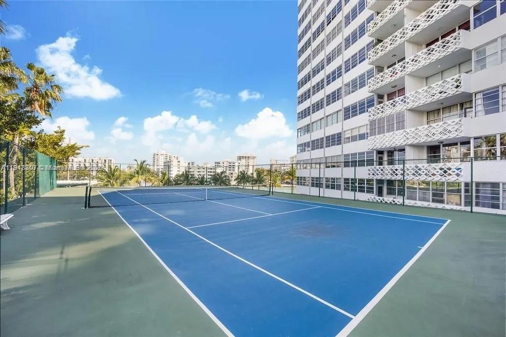 On-site tennis court beside the tower