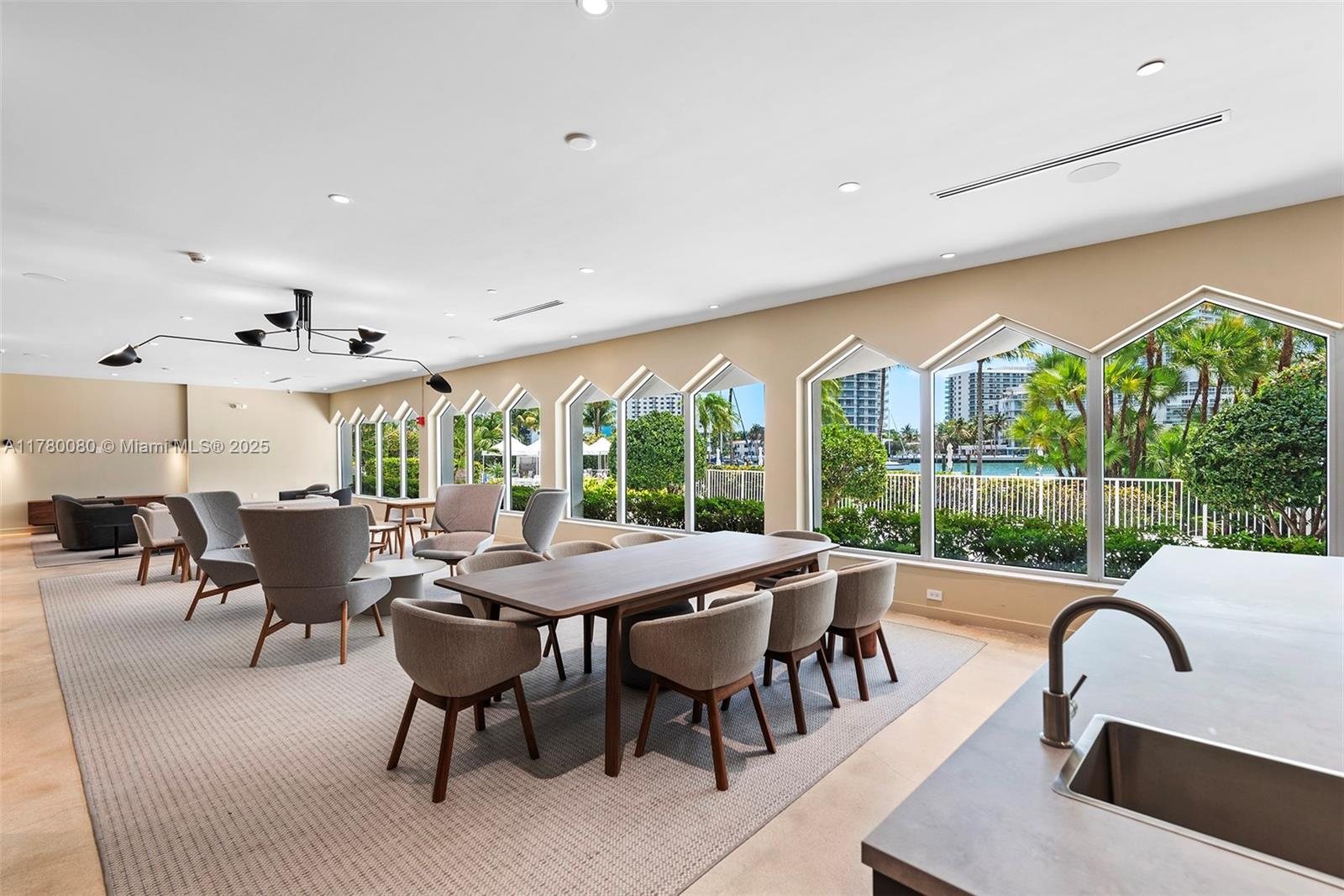 Residents' club room and social kitchen overlooking the pool