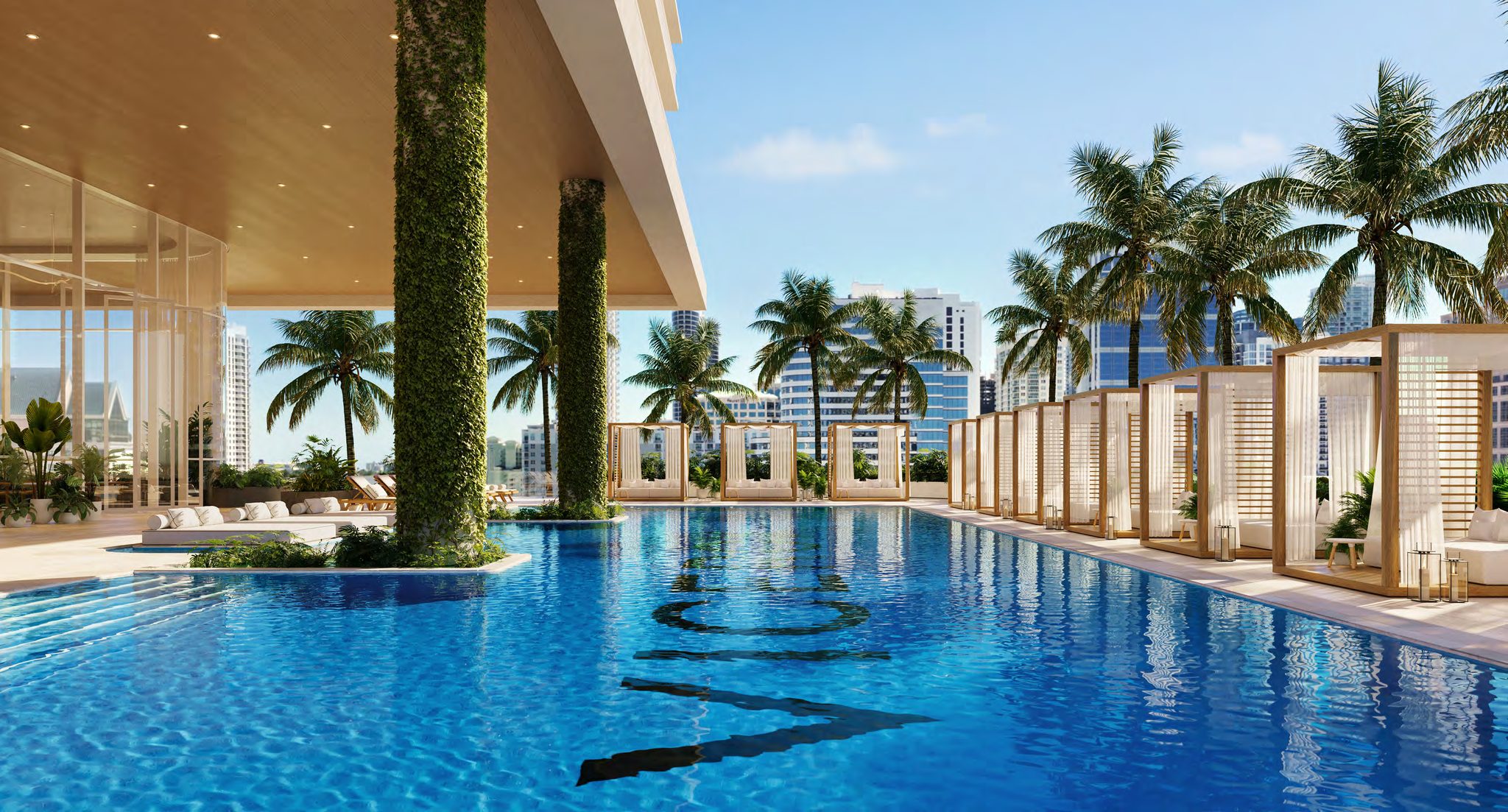 Resort-style pool deck with cabanas and daybeds